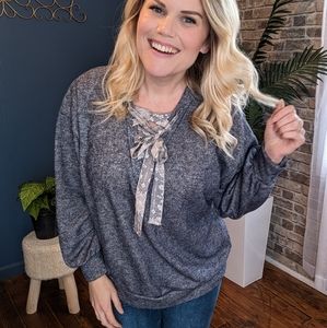 Navy blue sweatshirt with floral/Aztec front tie